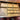 Bucarest Art & Antiques mahogany desk drawer with multiple wooden compartments and a brass Maple & Co. label