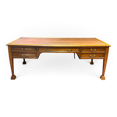 Bucarest Art & Antiques antique English mahogany desk by Maple & Co. with leather top and brass drawer pulls
