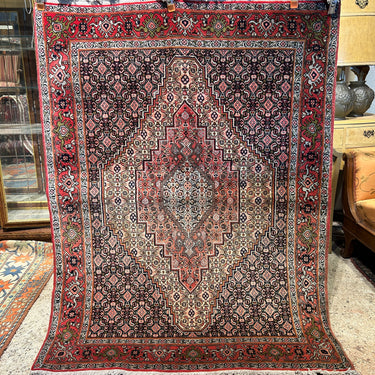 Alfombra Iraní zona central tonos rojos 160cm x 122cm