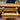 Bucarest Art & Antiques mahogany English desk by Maple & Co. featuring open drawers with brass handles and leather top